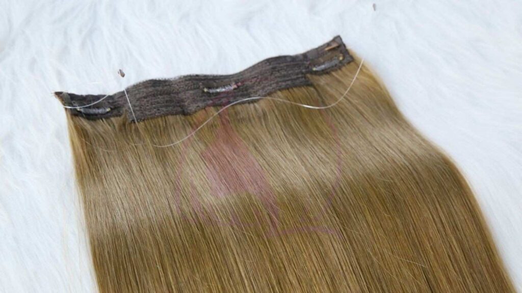 Checking the crown area for halo hair extension blending